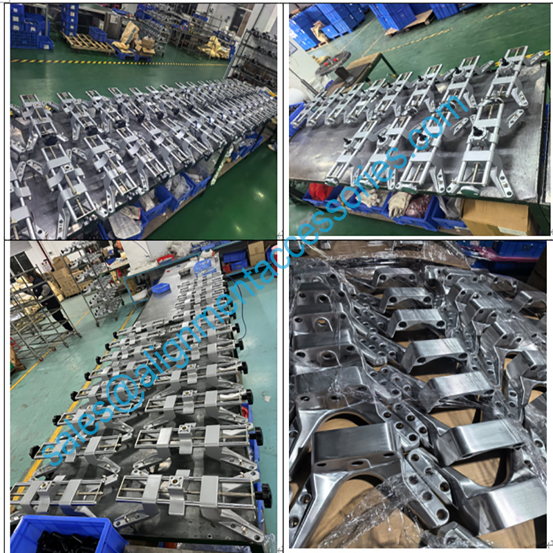 Truck wheel alignment clamp in production line Pinza per allineamento ruote di camion nella linea di produzione